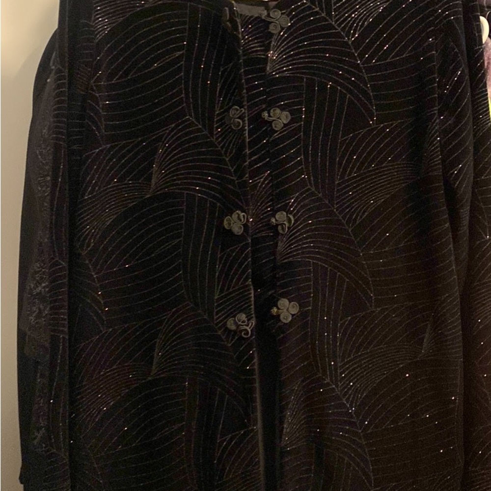Women’s evening cardigan with shoulder pads .